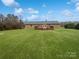 Large backyard with a wooden deck perfect for outdoor entertaining and relaxation at 189 Beech Brook Ln, Statesville, NC 28625