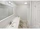 Clean bathroom features a sleek vanity, modern fixtures, and a shower-tub combo at 189 Beech Brook Ln, Statesville, NC 28625