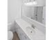 Bright bathroom features white cabinets and countertop, a white-framed mirror, and chrome faucet at 189 Beech Brook Ln, Statesville, NC 28625