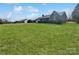 The well-manicured lawn and mature landscaping of the home create a welcoming atmosphere at 189 Beech Brook Ln, Statesville, NC 28625