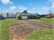Well-maintained home with a long driveway, attached garage and front yard at 189 Beech Brook Ln, Statesville, NC 28625