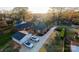An aerial view showcasing a well maintained home with lush landscaping, detached garage, and inviting outdoor spaces at 1937 Wilmore Dr, Charlotte, NC 28203