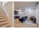 Cozy basement living area with a TV, armchairs, and wood-style flooring at 1937 Wilmore Dr, Charlotte, NC 28203