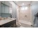 Bathroom featuring a shower/tub combination with white tiles and blue accent wall at 1937 Wilmore Dr, Charlotte, NC 28203