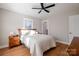 Cozy bedroom with hardwood floors, a ceiling fan, and natural light streaming in at 1937 Wilmore Dr, Charlotte, NC 28203