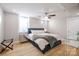 Bedroom featuring a bed with bedside tables, ceiling fan, and wood-style flooring at 1937 Wilmore Dr, Charlotte, NC 28203