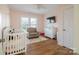 Bright Bedroom with a crib, comfortable armchair, and plenty of space for play at 1937 Wilmore Dr, Charlotte, NC 28203