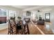 Bright dining area leading into a comfortable living area and flooded with natural light at 1937 Wilmore Dr, Charlotte, NC 28203