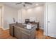Bright office space with a large desk, ceiling fan, and hardwood floors at 1937 Wilmore Dr, Charlotte, NC 28203