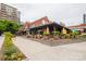 Exterior of restaurant with landscaping and outdoor seating including views of other local businesses and modern architecture at 1937 Wilmore Dr, Charlotte, NC 28203