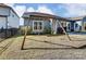 Spacious backyard featuring a well-maintained lawn, swingset, and patio with outdoor seating at 2056 Angel Oak Dr, Fort Mill, SC 29715