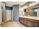 Well-appointed bathroom featuring a double vanity, large mirror, and tiled floor at 2056 Angel Oak Dr, Fort Mill, SC 29715