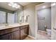 Well-lit bathroom features a double vanity, framed mirror, and a separate toilet room for added privacy at 2056 Angel Oak Dr, Fort Mill, SC 29715