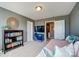 Bedroom featuring comfortable daybed, television, and bookshelf at 2056 Angel Oak Dr, Fort Mill, SC 29715
