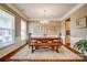 Bright dining room with a wooden table set on a white rug at 2056 Angel Oak Dr, Fort Mill, SC 29715