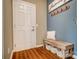 Inviting entryway featuring a rustic bench, hooks, and stylish decor on hardwood floors at 2056 Angel Oak Dr, Fort Mill, SC 29715