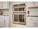Stainless steel oven and microwave are built into white cabinets, complemented by granite countertops at 2056 Angel Oak Dr, Fort Mill, SC 29715