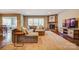 Spacious living room featuring plush seating, a stone fireplace, and hardwood floors with an area rug at 2056 Angel Oak Dr, Fort Mill, SC 29715