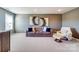 Comfortable living room featuring neutral decor, modern artwork, and comfortable seating with natural light at 2056 Angel Oak Dr, Fort Mill, SC 29715