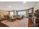 Spacious living room with a cozy fireplace, perfect for Gathering gatherings and entertaining guests at 2056 Angel Oak Dr, Fort Mill, SC 29715