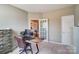 Office with a modern desk, comfortable chair, and ample storage, adjacent to a sunlit room at 2056 Angel Oak Dr, Fort Mill, SC 29715
