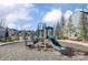 Community playground featuring multiple slides, climbing structures and a bench at 2056 Angel Oak Dr, Fort Mill, SC 29715