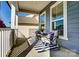 Inviting front porch with seating area, perfect for relaxing and enjoying the outdoors at 2056 Angel Oak Dr, Fort Mill, SC 29715