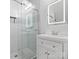 Modern bathroom featuring white vanity, glass shower, and stylish mirror at 2100 Bluebonnet Ln, Matthews, NC 28104