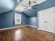 Spacious bedroom featuring hardwood floors, a ceiling fan, and a window with natural light at 2100 Bluebonnet Ln, Matthews, NC 28104