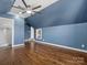 Cozy bedroom featuring hardwood floors, recessed lighting, and an ensuite bathroom at 2100 Bluebonnet Ln, Matthews, NC 28104