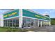Commercial building exterior with large windows and ample parking at 2100 Bluebonnet Ln, Matthews, NC 28104