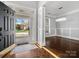 Elegant foyer featuring dark wood floors, a decorative chandelier, and an open view of the front yard at 2100 Bluebonnet Ln, Matthews, NC 28104