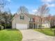 Charming two-story home with a two car garage, long driveway, and well-manicured front lawn at 2100 Bluebonnet Ln, Matthews, NC 28104