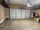Organized two-car garage with epoxy flooring and ample storage space at 2100 Bluebonnet Ln, Matthews, NC 28104