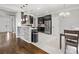 Modern eat-in kitchen with stainless steel appliances and breakfast bar at 2100 Bluebonnet Ln, Matthews, NC 28104