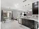 Modern kitchen with stainless steel appliances and breakfast bar at 2100 Bluebonnet Ln, Matthews, NC 28104