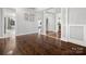 Spacious living room with hardwood floors, modern lighting, and a welcoming atmosphere at 2100 Bluebonnet Ln, Matthews, NC 28104