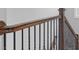 Elegant staircase with dark wood handrail and black iron spindles at 2100 Bluebonnet Ln, Matthews, NC 28104