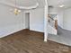 An elegant dining room with hardwood floors, wainscoting, and a stylish chandelier at 21005 Brinkley St, Cornelius, NC 28031