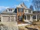 Charming two-story home featuring a two-car garage and a welcoming front porch at 21005 Brinkley St, Cornelius, NC 28031