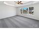 A spacious bedroom offers natural light, new carpet, and ample room for relaxation and personalization at 21005 Brinkley St, Cornelius, NC 28031