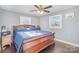 Comfortable bedroom featuring a dark wood bed, neutral wall color, and natural light from the windows at 2320 Monterey Park Dr, Gastonia, NC 28054