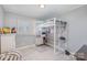 Bright bedroom with a unique lofted bed featuring a built-in desk and storage space at 2320 Monterey Park Dr, Gastonia, NC 28054