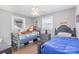 Charming bedroom with two beds and wood-look flooring offers a cozy space at 2320 Monterey Park Dr, Gastonia, NC 28054