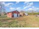 View of detached garage and spacious backyard, perfect for outdoor activities at 2320 Monterey Park Dr, Gastonia, NC 28054