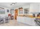 Bright kitchen featuring open shelving, wood countertops, gas range, and eat-in dining area at 2320 Monterey Park Dr, Gastonia, NC 28054