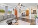 Cozy living area with comfortable seating, hardwood floors, and seamless transition to dining area at 2320 Monterey Park Dr, Gastonia, NC 28054