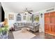 Inviting living room featuring a plush grey sectional, hardwood floors, and abundant natural light at 2320 Monterey Park Dr, Gastonia, NC 28054