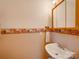 Cozy powder room featuring beadboard wallpaper, a white sink, medicine cabinet and towel rack at 2615 High Ridge Church Rd, Marshville, NC 28103