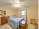 A cozy bedroom featuring a full-size bed, ceiling fan, and wood furniture at 2615 High Ridge Church Rd, Marshville, NC 28103
